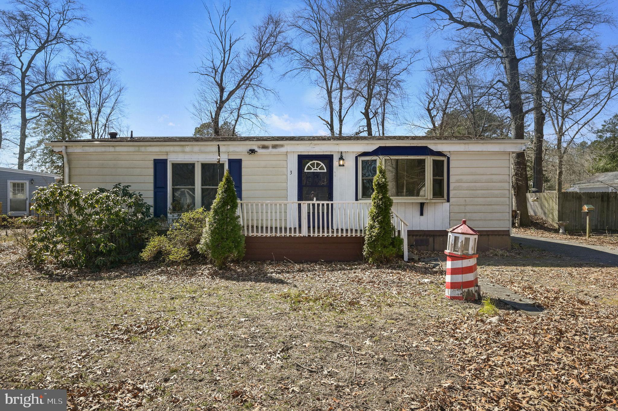 front view of a house with a tree
