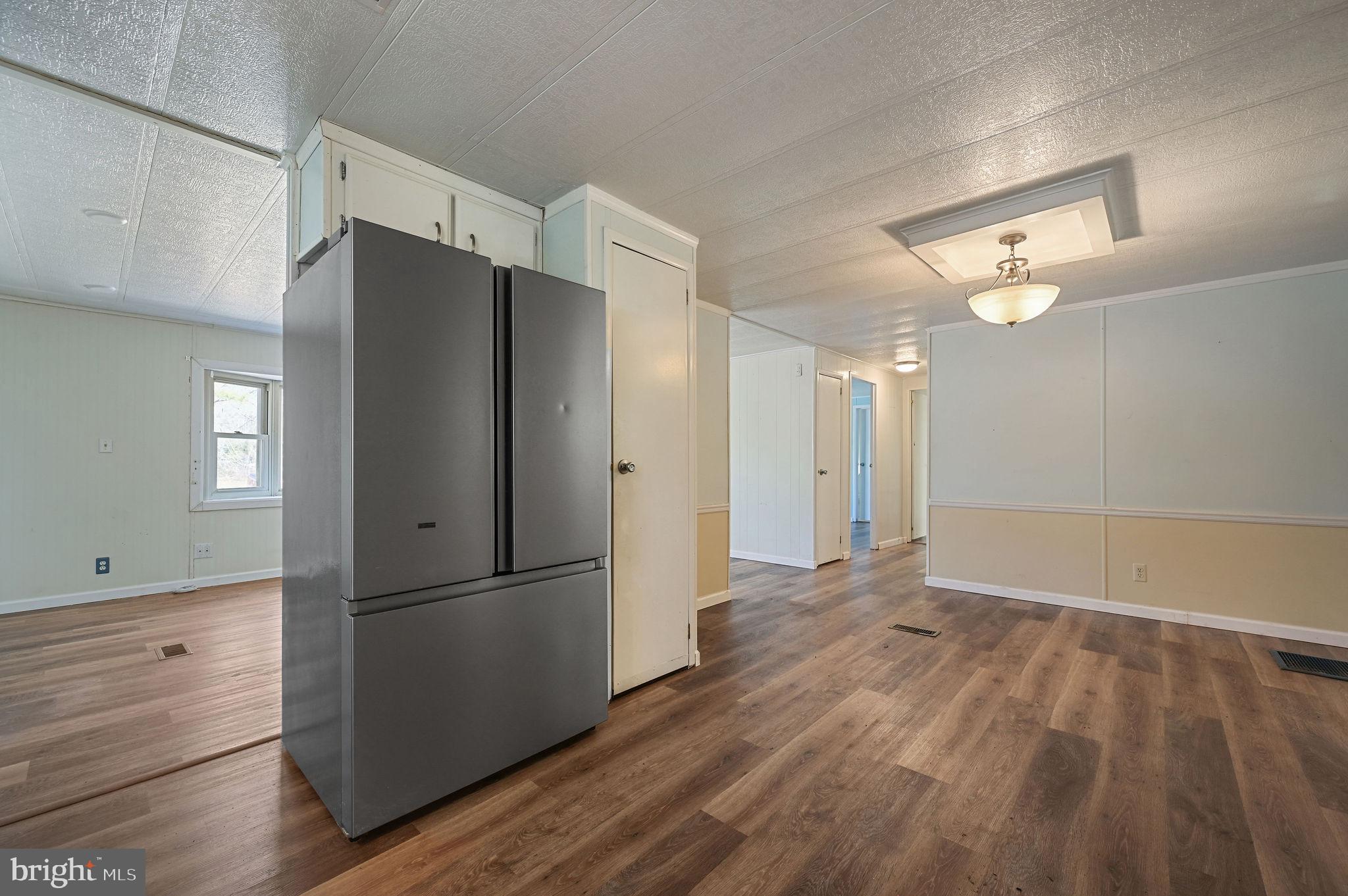 3 Patterson Drive Georgetown, DE 19947 - Photo 14 of 25 a view of a kitchen with a refrigerator and a stove top oven