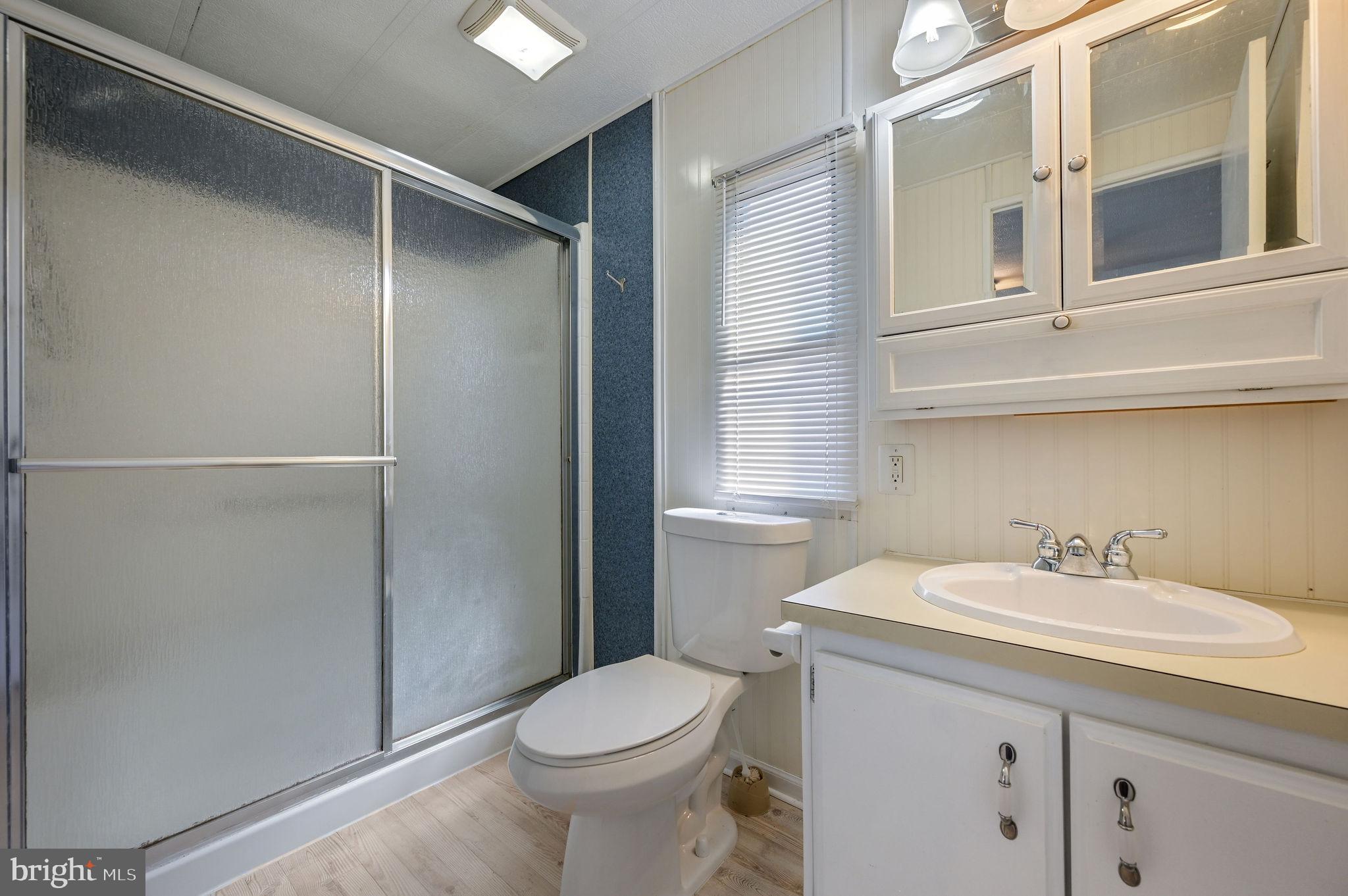 3 Patterson Drive Georgetown, DE 19947 - Photo 21 of 25 a bathroom with a sink toilet and vanity