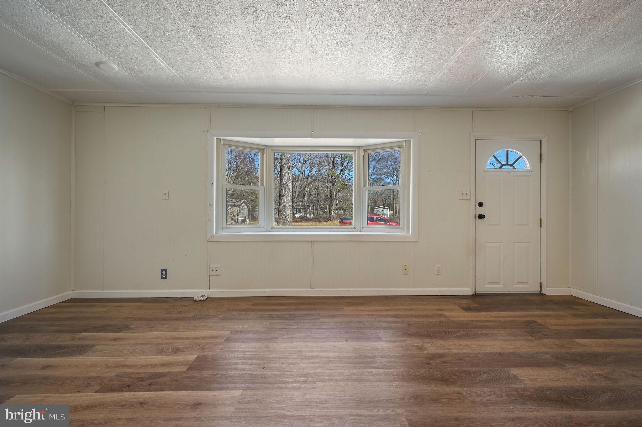 3 Patterson Drive Georgetown, DE 19947 - Photo 8 of 25 a view of a room with wooden floor and window