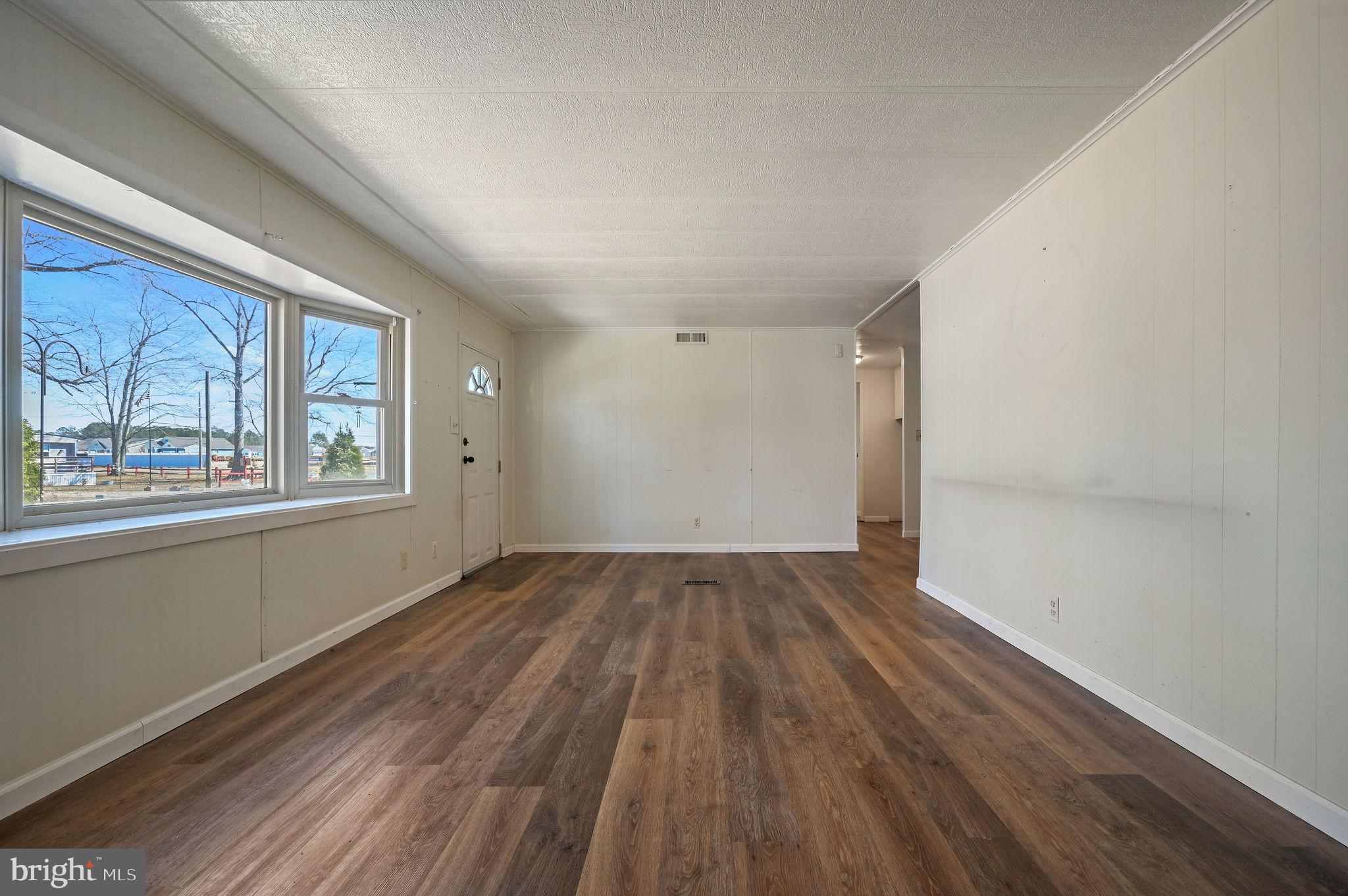 3 Patterson Drive Georgetown, DE 19947 - Photo 9 of 25 wooden floor in an empty room with a window