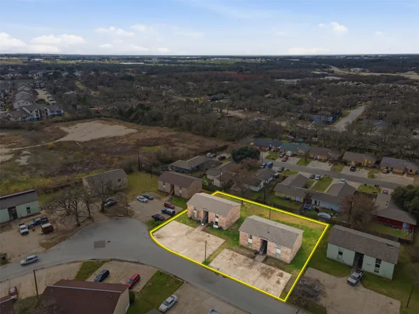 an aerial view of a city with ocean view