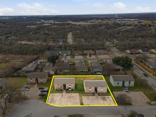 an aerial view of a house with a swimming pool