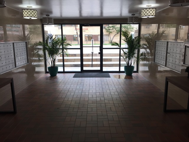 1025 West Hollywood Avenue, Unit 218 Chicago, IL 60660 - Photo 2 of 10 a view of an empty room with a window