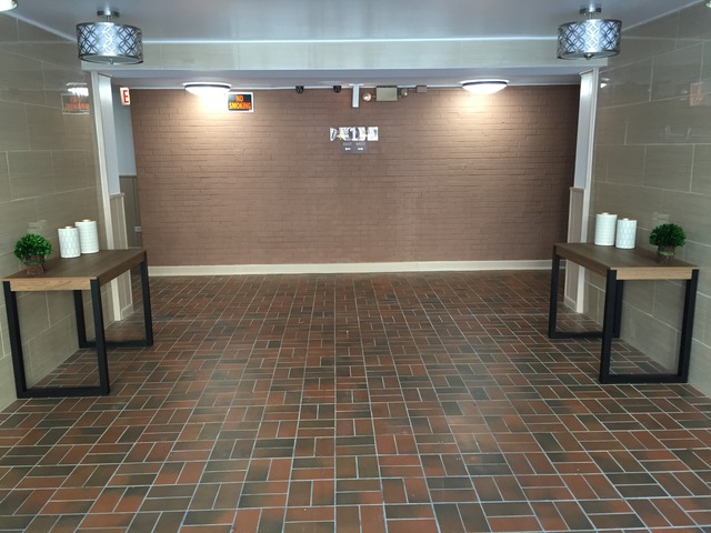 1025 West Hollywood Avenue, Unit 218 Chicago, IL 60660 - Photo 3 of 10 a view of an empty room with a chandelier