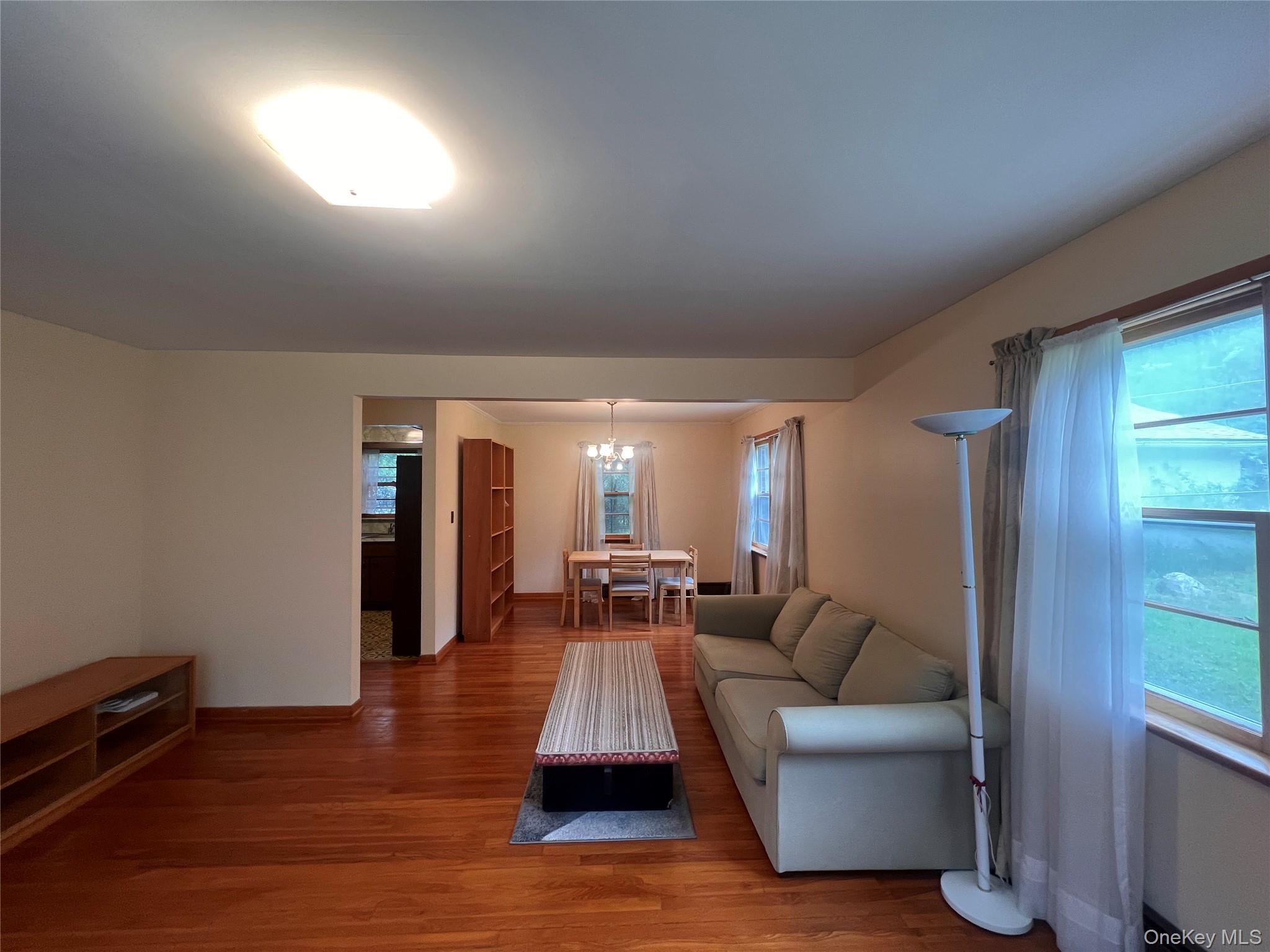 4 Beach Road, Unit G Glen Spey, NY 12737 - Photo 2 of 16 a living room with furniture and a wooden floor