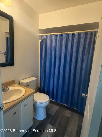a bathroom with a toilet and a sink