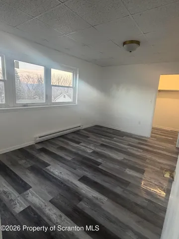 a view of a room that has a window