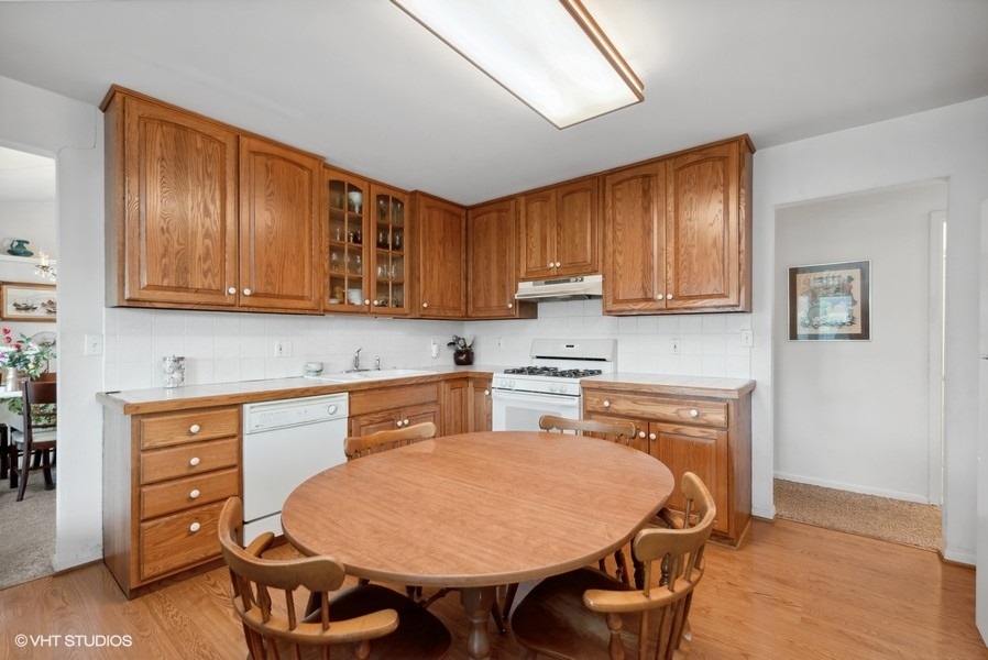 642 Deerpath Road East Dundee, IL 60118 - Photo 5 of 13 a kitchen with a cabinets appliances and a center island