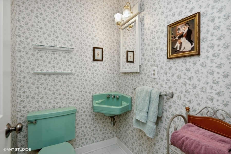 642 Deerpath Road East Dundee, IL 60118 - Photo 10 of 13 a bathroom with a toilet a sink and mirror