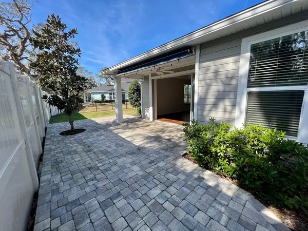 a view of an house with backyard space and garden