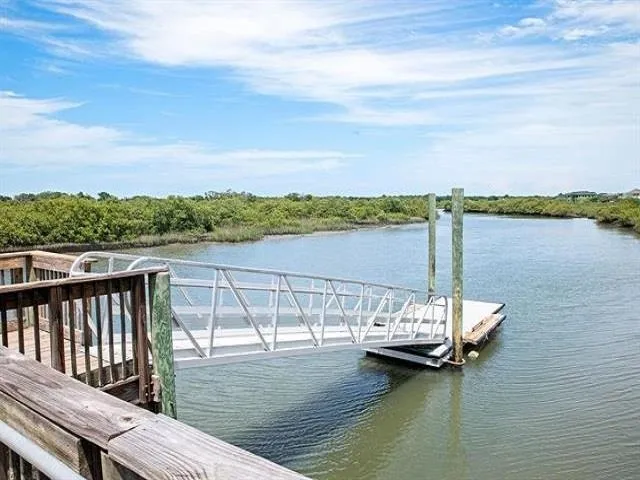 a view of deck with lake and mountain view