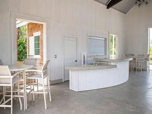 a view of kitchen with dining table and chairs