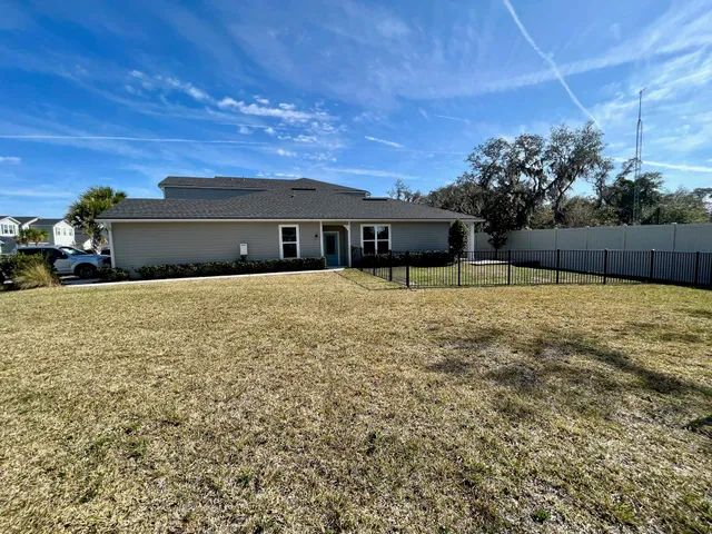 a view of a house with a big yard
