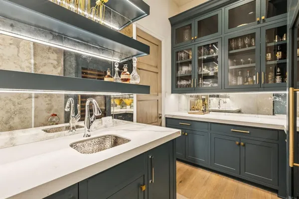a kitchen with a sink and a refrigerator