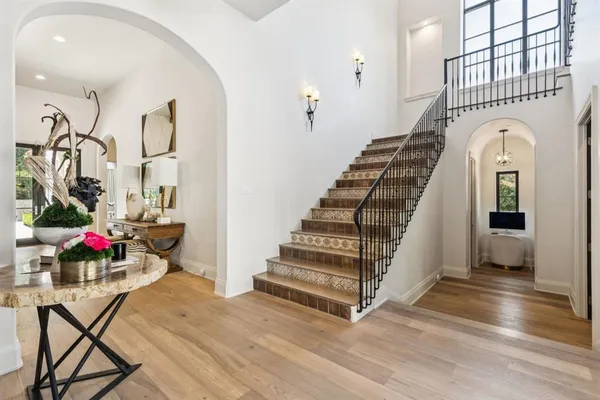 a view of entryway and hall with wooden floor