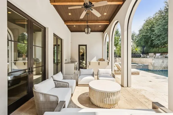 a living room with a couch and a chandelier