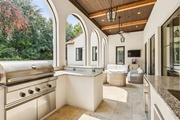 a open kitchen with stainless steel appliances granite countertop a stove and a refrigerator