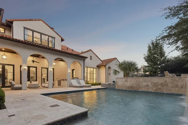 a view of a house with swimming pool