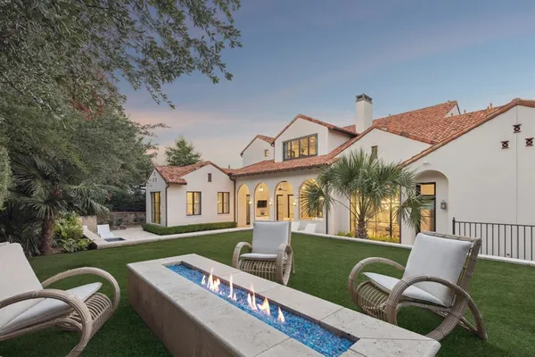 a view of a house with a couches in a patio
