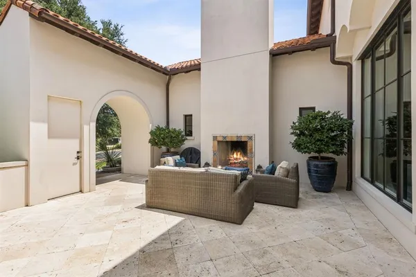 a view of a patio with couches and potted plants