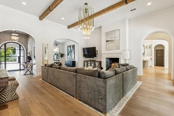 a living room with fireplace furniture and a flat screen tv