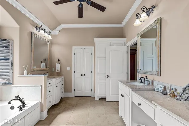 a spacious bathroom with a double vanity sink a mirror and shower