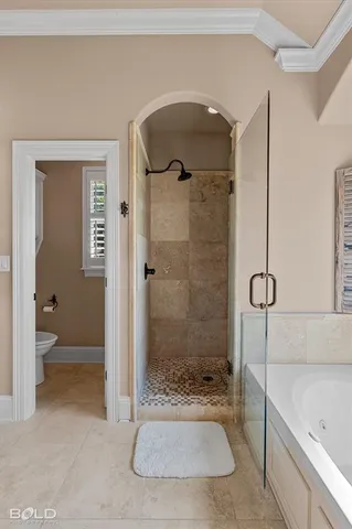 a bathroom with a granite countertop sink a toilet and shower
