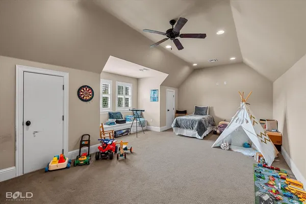 a children room with toys and a ceiling fan