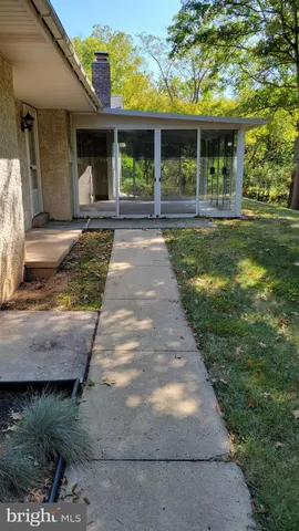 a view of a field with an trees in the background