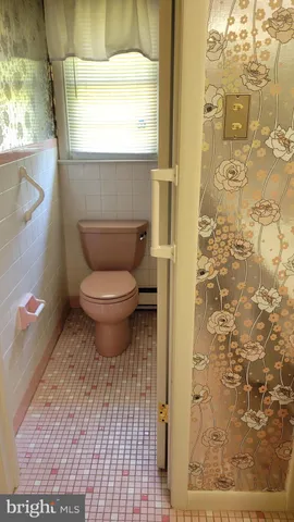 a view of an empty room and a window