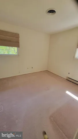 a view of an empty room and window