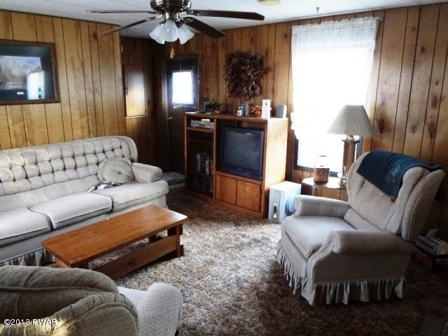 69 Salem Heights Rd Lake Lake Ariel, PA 18436 - Photo 6 of 18 a living room with furniture and a chandelier