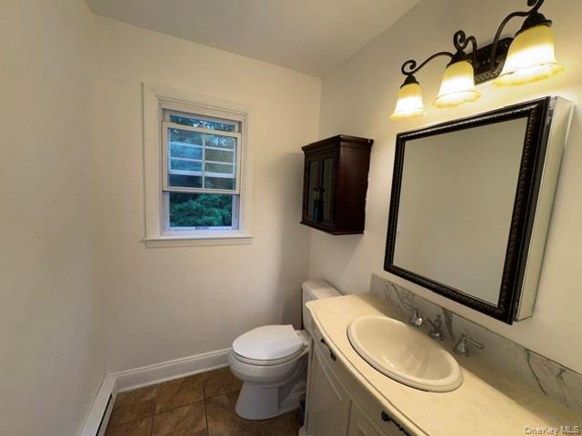 129 Salem Road Fishkill, NY 12524 - Photo 12 of 44 Half bathroom on 1st floor with ceramic tile flooring an a window.