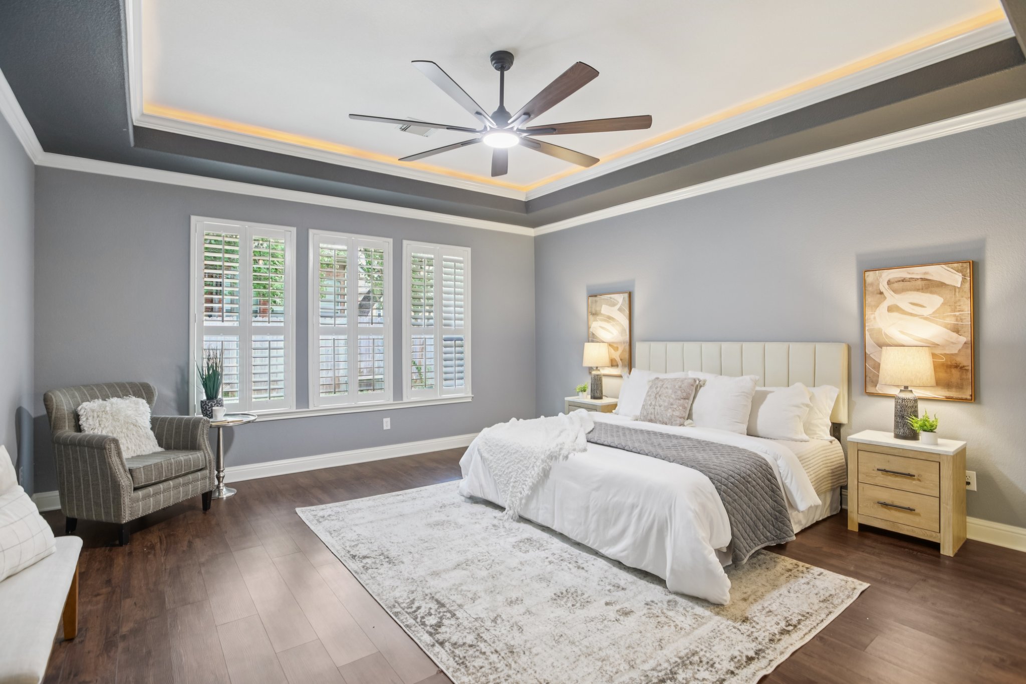 10525 Roy Butler Drive Austin, TX 78717 - Photo 21 of 40 Spacious primary bedroom on the main level with high ceilings and ceiling fan