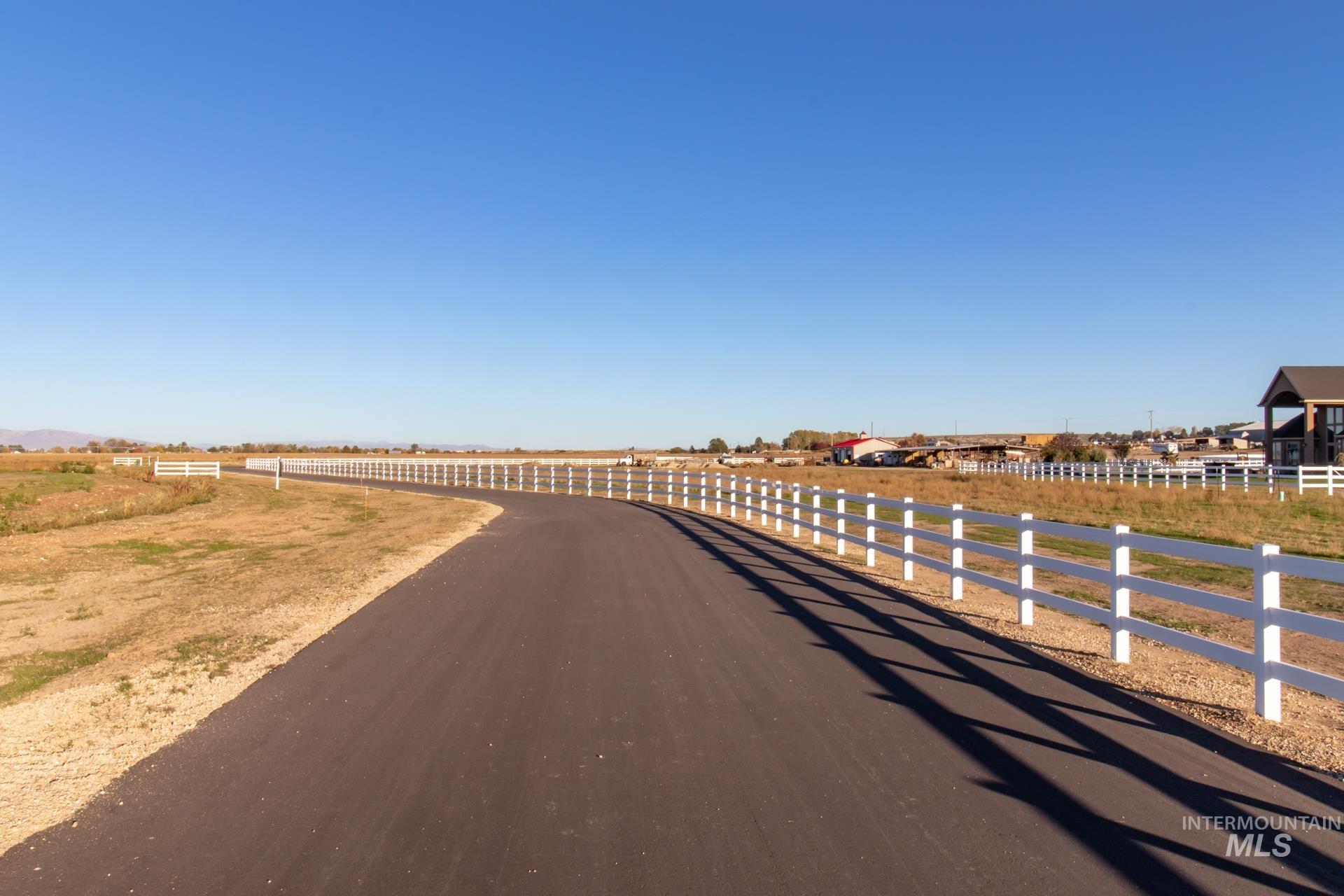 4276 West Mockingjay Kuna, ID 83634 - Photo 27 of 35 View of asphalt road featuring a rural view