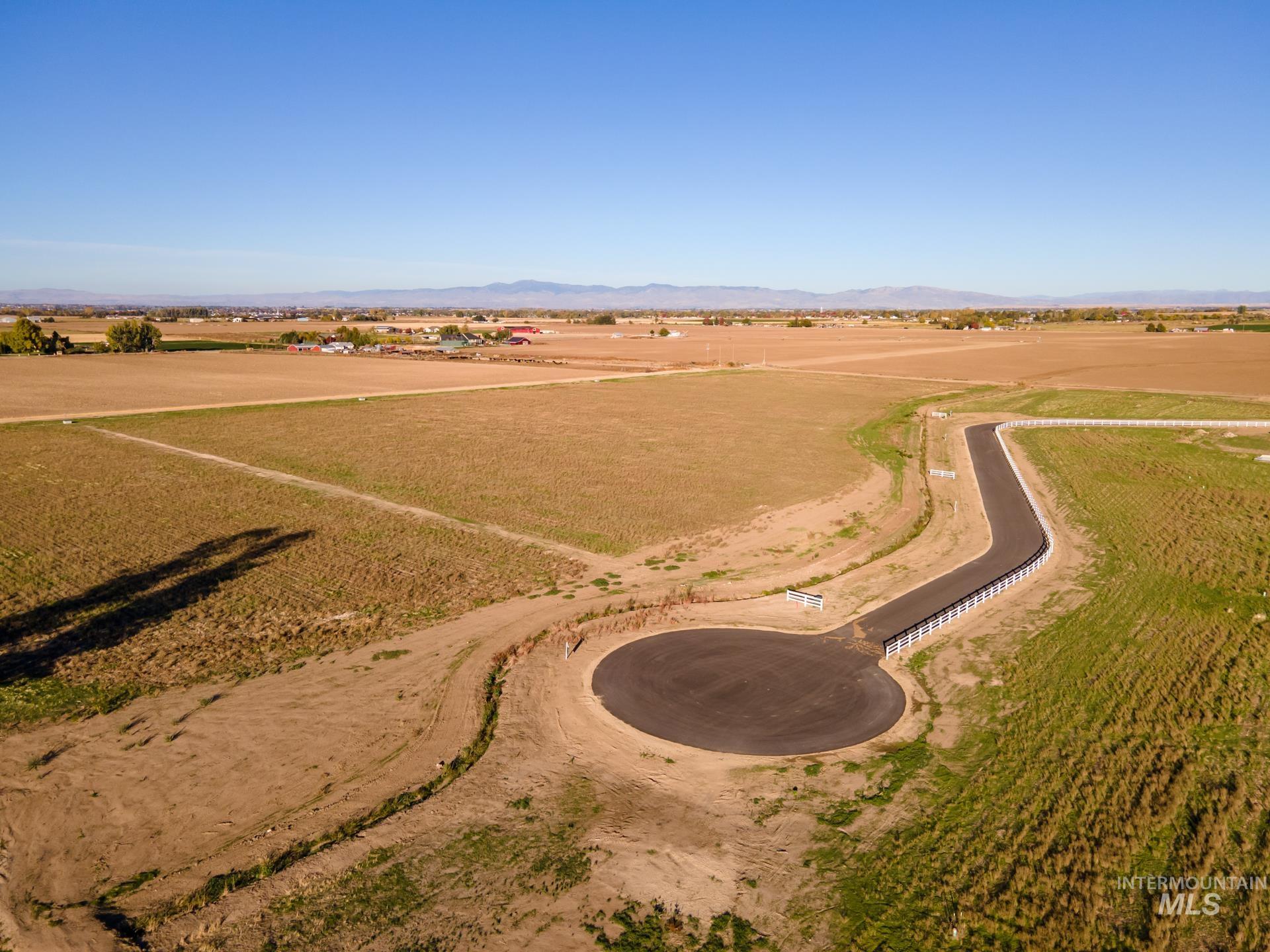 4276 West Mockingjay Kuna, ID 83634 - Photo 32 of 35 Aerial overview of property's location with rural landscape and a mountain backdrop