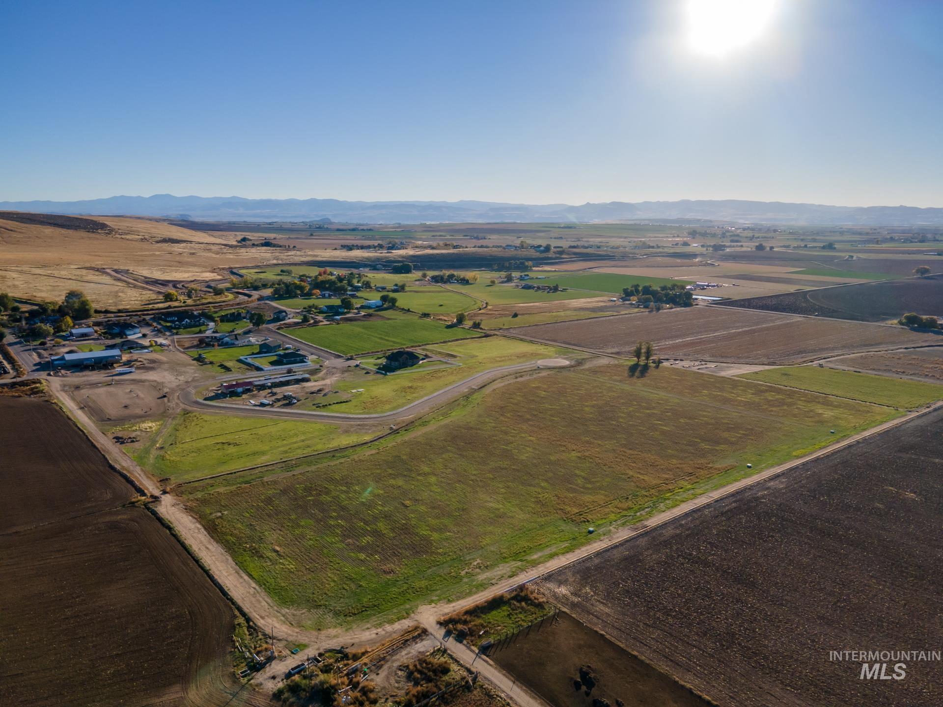 4276 West Mockingjay Kuna, ID 83634 - Photo 9 of 35 Aerial overview of property's location with rural landscape and a mountainous background