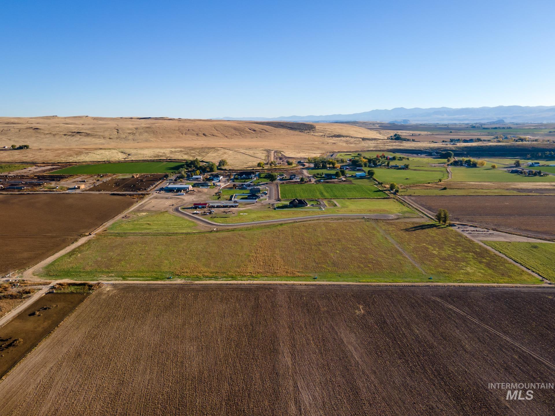 4276 West Mockingjay Kuna, ID 83634 - Photo 10 of 35 Overview of rural landscape with mountains and rows of crops