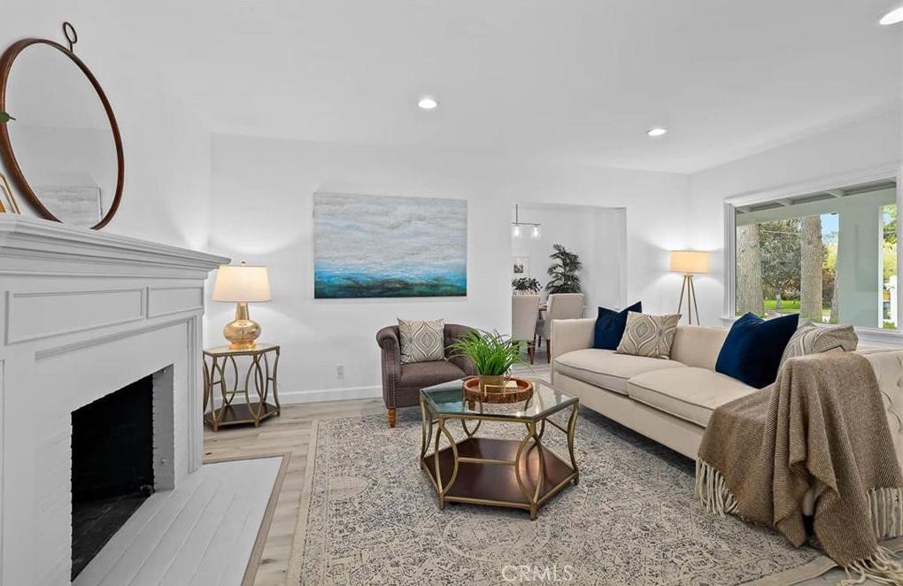 100 Eastern Pasadena, CA 91107 - Photo 7 of 18 a living room with furniture a mirror and a fireplace