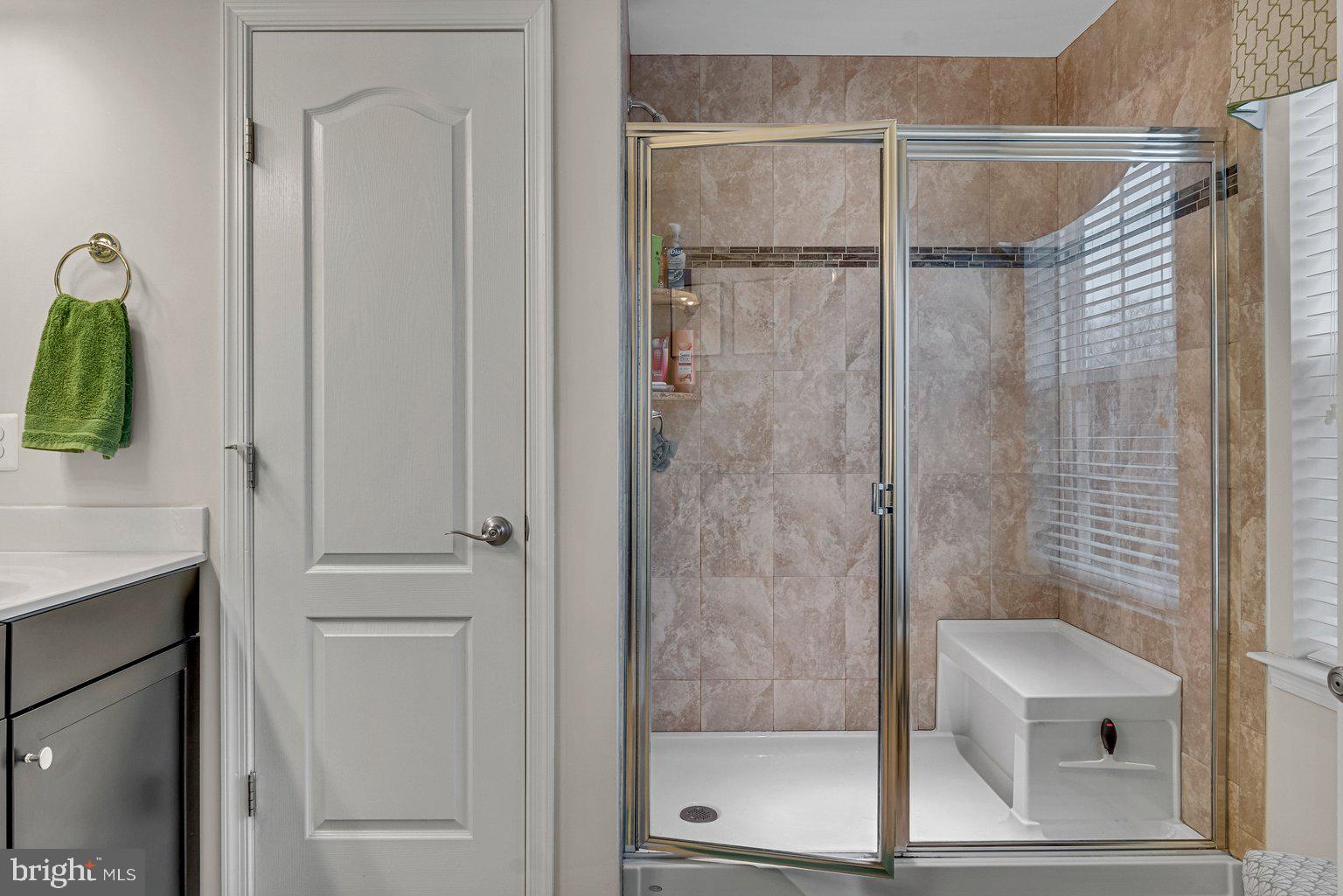 930 Ramble Run Road Baltimore, MD 21220 - Photo 25 of 54 Primary Bath With Ceramic Tile Surround