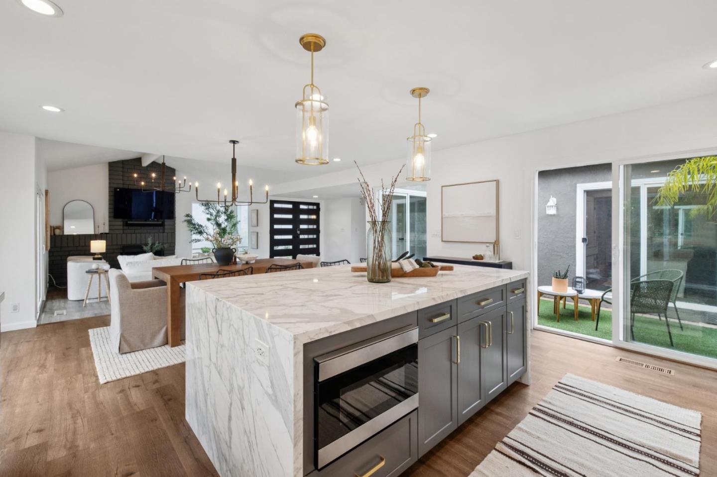 1962 Rancho Verde Circle West Danville, CA 94526 - Photo 27 of 60 a kitchen with kitchen island a sink stove and wooden floor