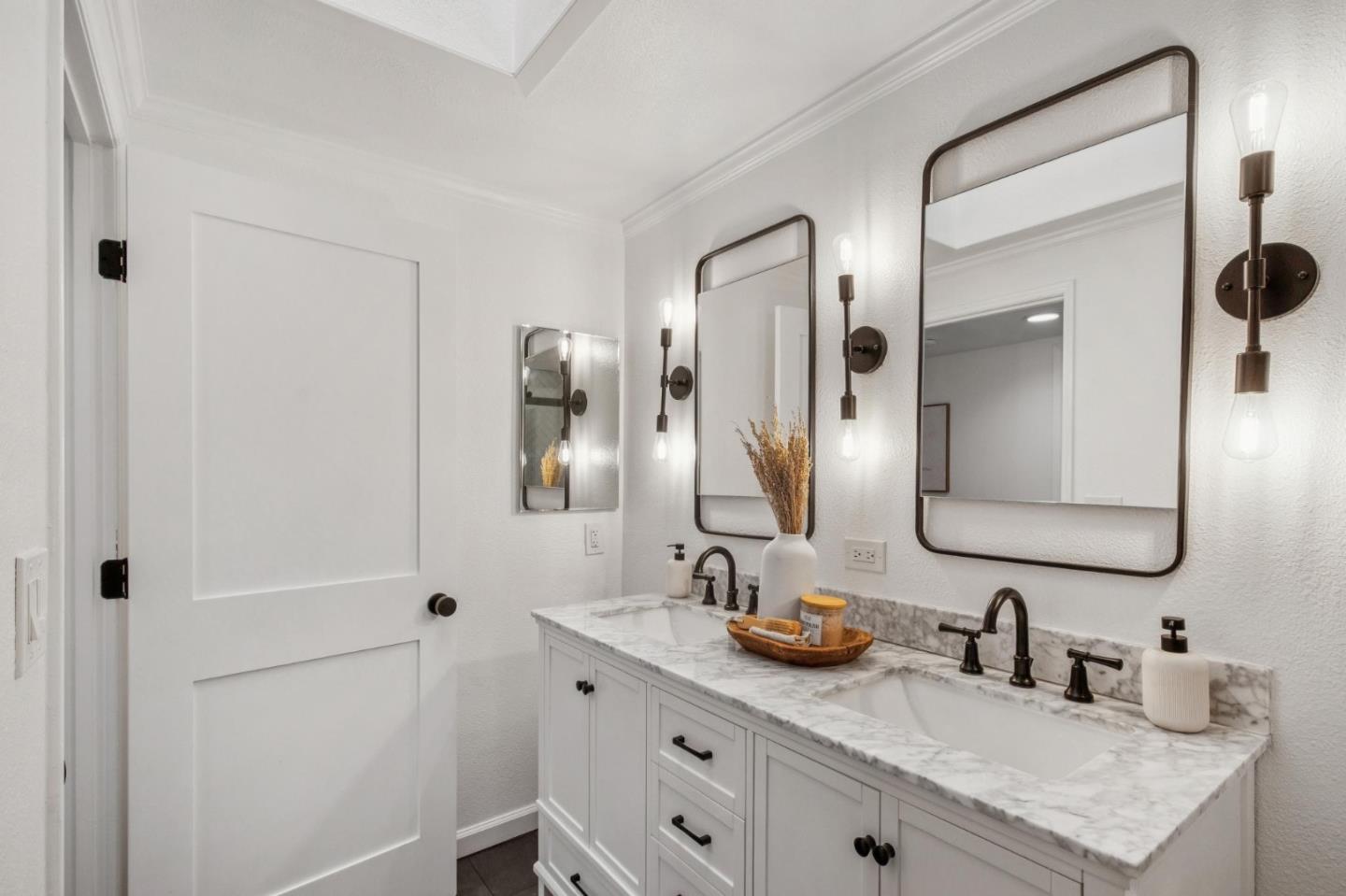 1962 Rancho Verde Circle West Danville, CA 94526 - Photo 48 of 60 a bathroom with a double vanity sink and mirror