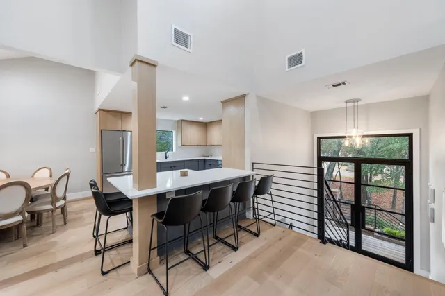 a view of a dining room with furniture window and outside view