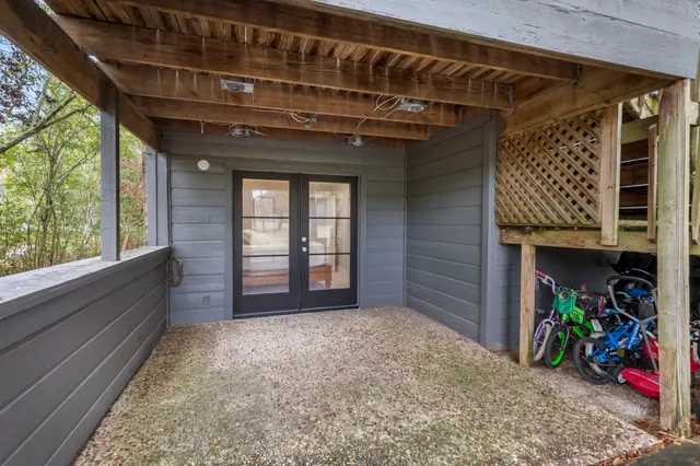 a spacious bedroom with a bed and a lamp