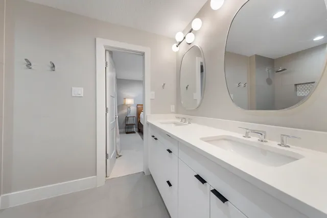 a view of an empty room with a window and storage