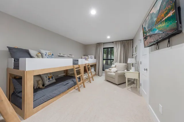 a white toilet sitting next to a bathroom sink