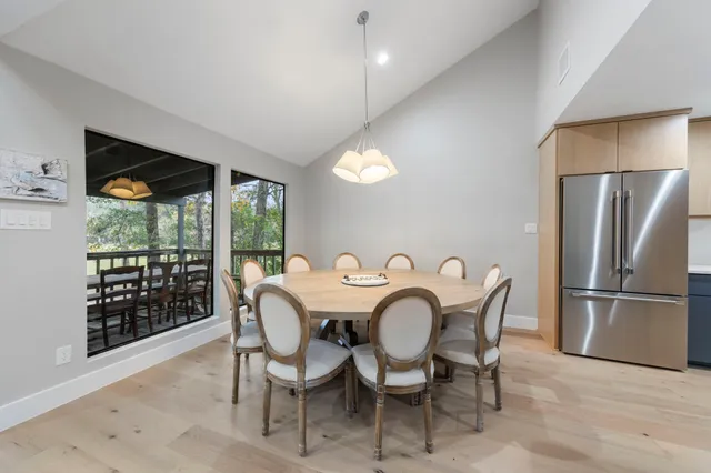 a view of a patio with table and chairs