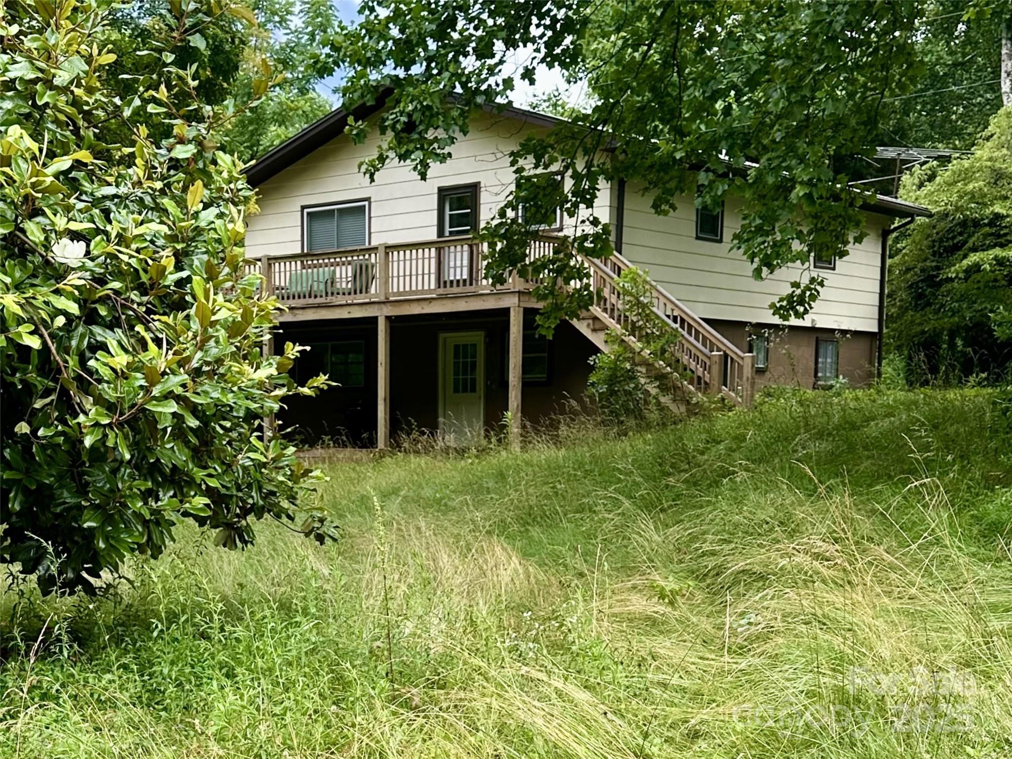 233 Dills Branch Road Sylva, NC 28779 - Photo 1 of 1 a house view with a garden space