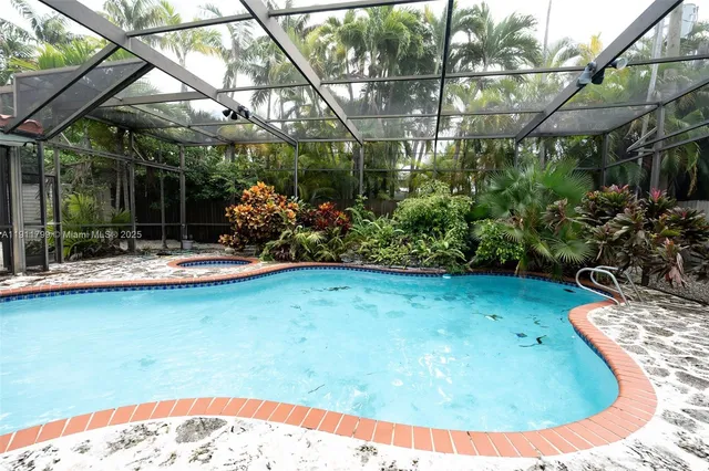 a view of a swimming pool with a patio